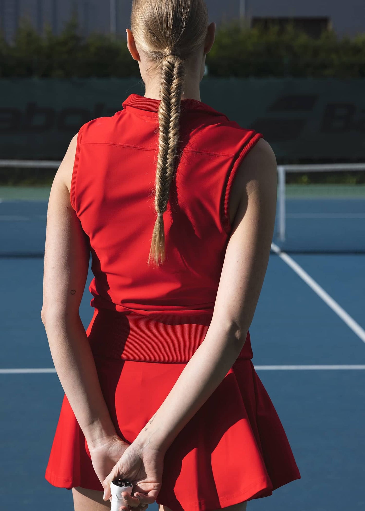 Back of women's red tennis tank named after Margaret Court