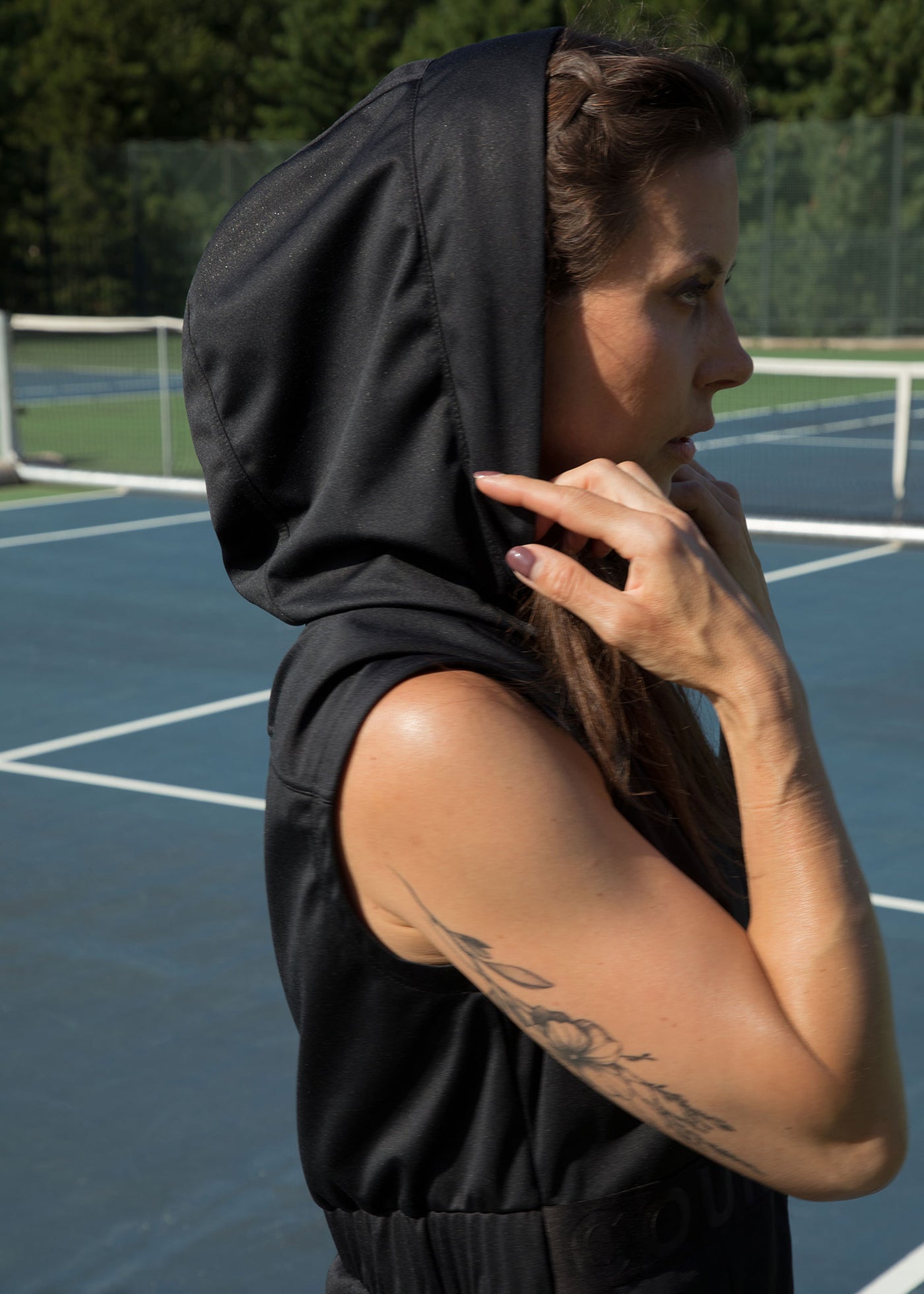 Model wearing tennis vest (with hood up) named after Coco Gauff