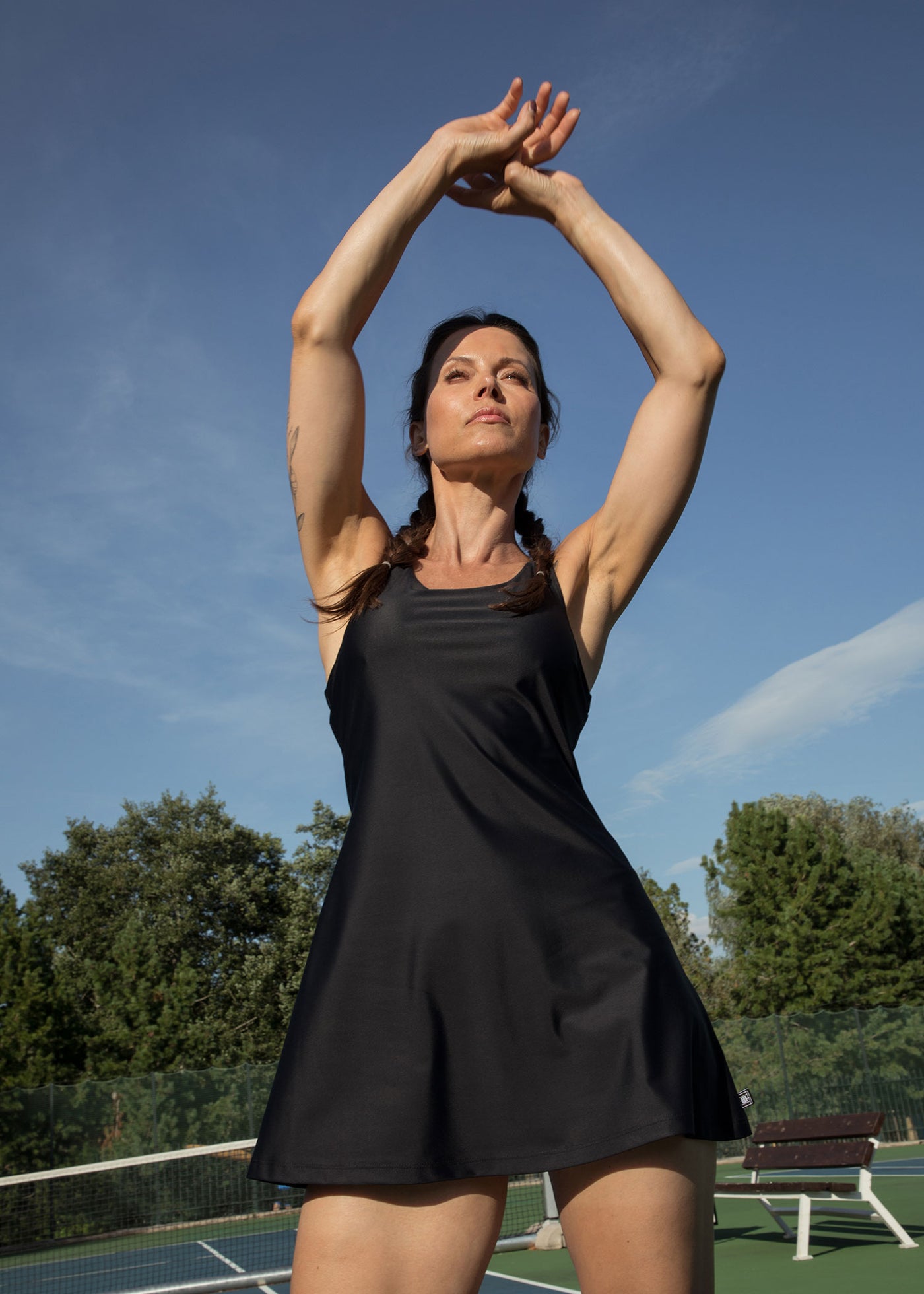 Model wearing black tennis line dress Kaia named after Kaia Kanepi
