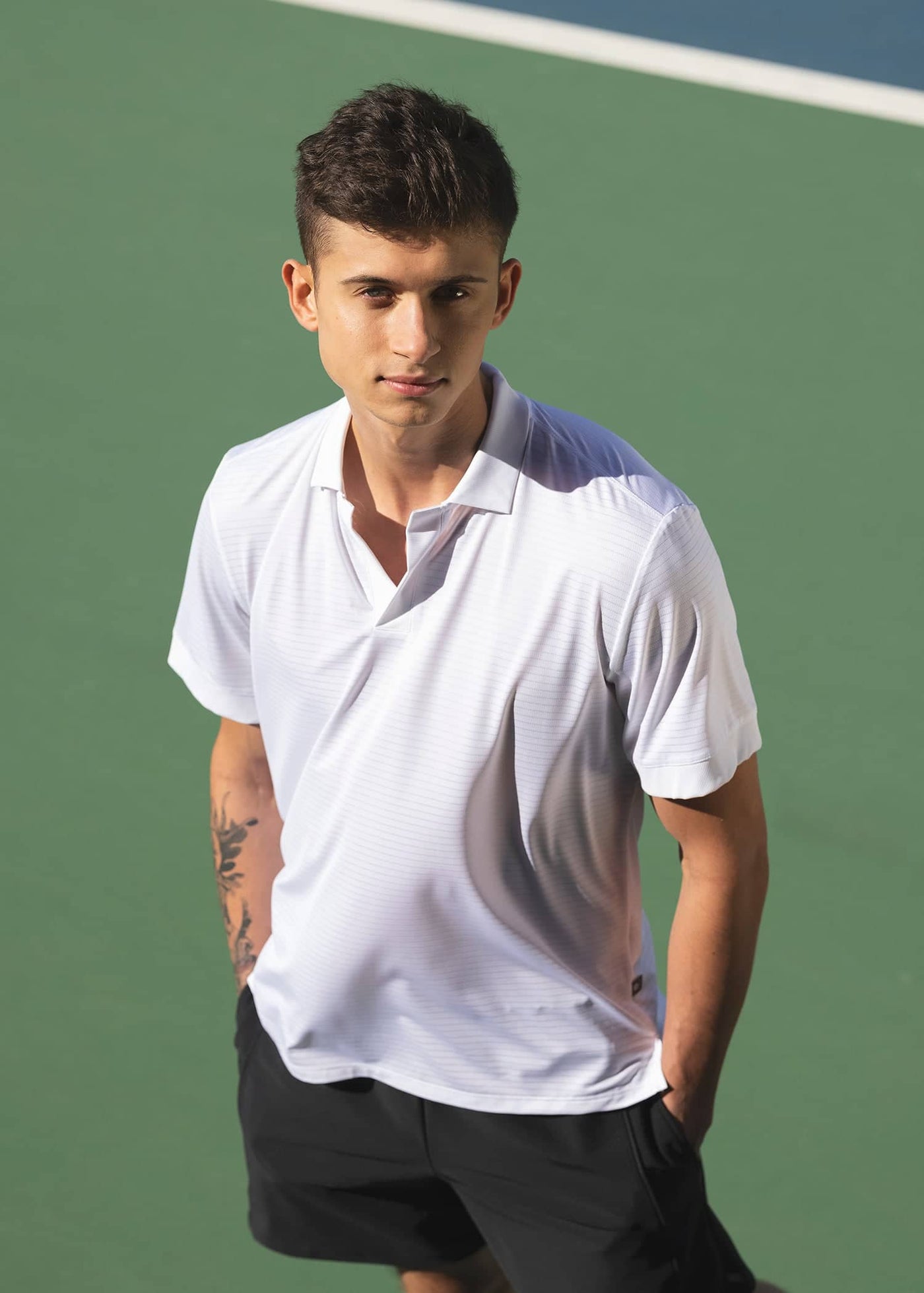 Model in men's tennis polo shirt named after Daniil Medvedev